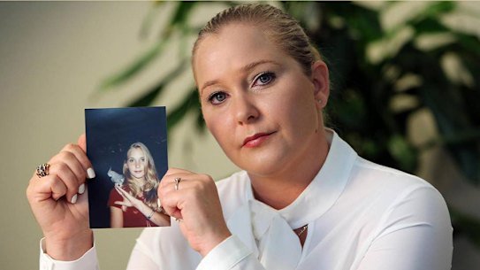 Virginia Giuffre in 2022, with a photo of herself as a teenager.