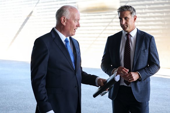 Mark Readings and Matthew Pavlich arrive at the service on Monday.