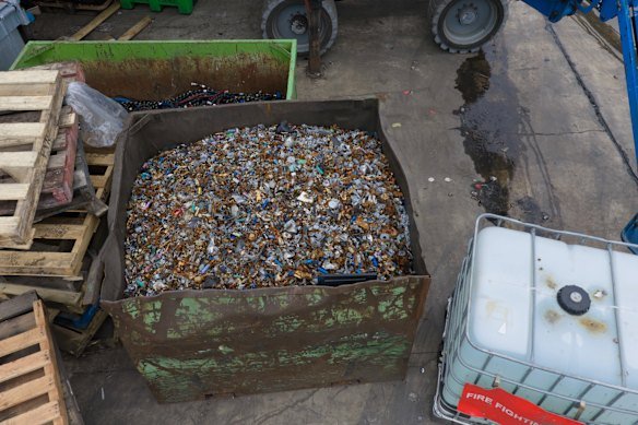 A large container holds rusted e-waste debris at Recycal’s Ringwood site.
