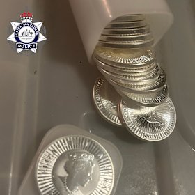 Police seized an estimated $82,000 worth in sovereign gold and silver (pictured) coins.