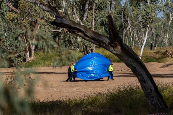 Police at the scene where missing five-year-old Kumanjayi Little Baby was discovered on Thursday.