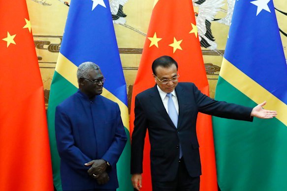 Former Solomon Islands prime minister Manasseh Sogavare, left, was regarded as the most pro-China leader in the Pacific. 