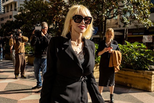 Mark Latham’s lawyer Zali Burrows leaves Downing Centre Local Court on Wednesday.