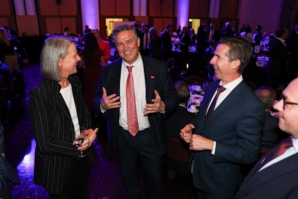 Miller holds court flanked by Secretary to the Treasury Jenny Wilkinson and former MP Simon Birmingham.