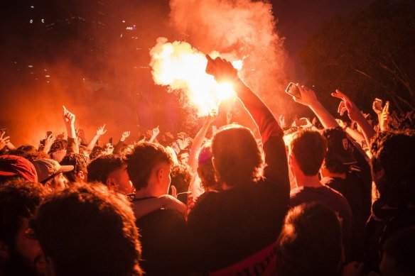 Flares are thrown at Federation Square during the World Cup in 2022.