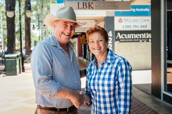 Barnaby Joyce and Pauline Hanson shake hands after the former joined One Nation in December.