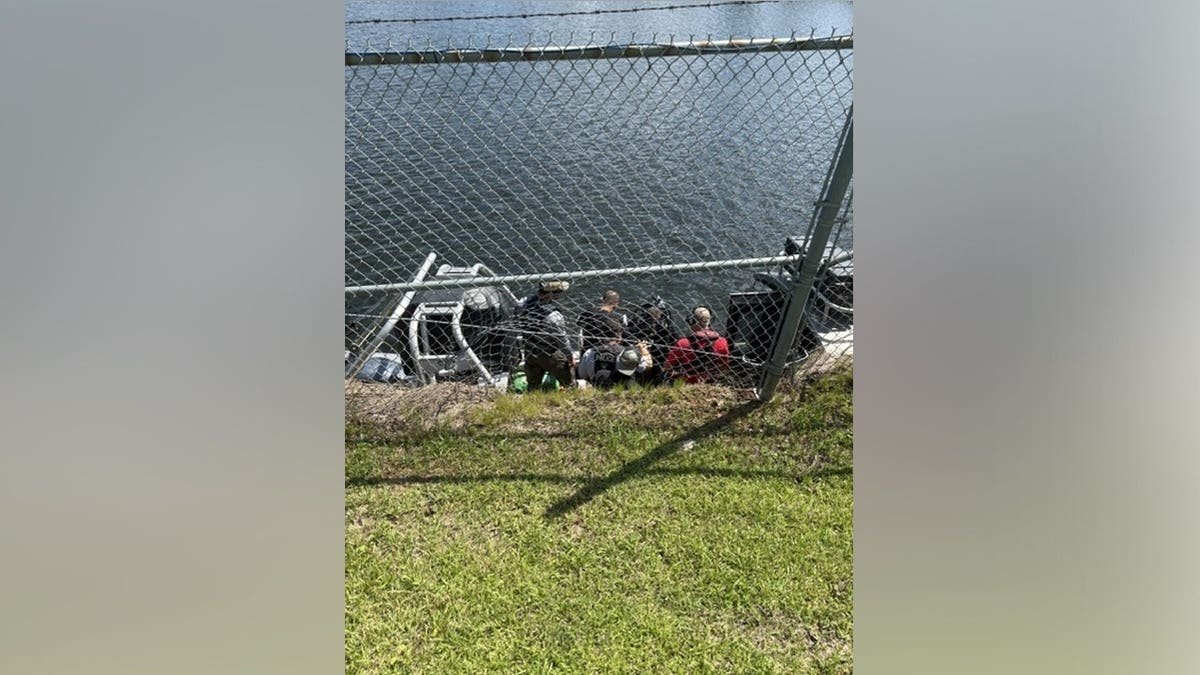 An inter-agency team in Alabama assesses an IED at the Converse Reservoir Dam in Mobile, Alabama.