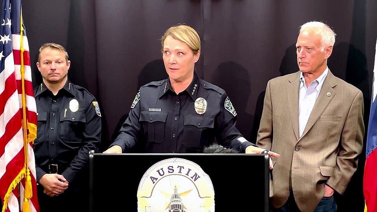 Austin Police Chief Lisa Davis speaks alongside city officials during a press conference.