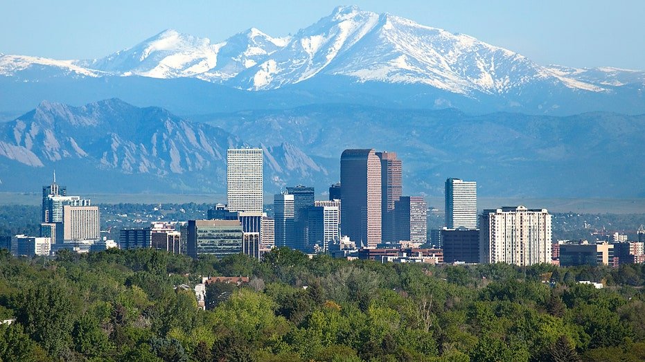 Denver, Colorado, with a mountain in the background.