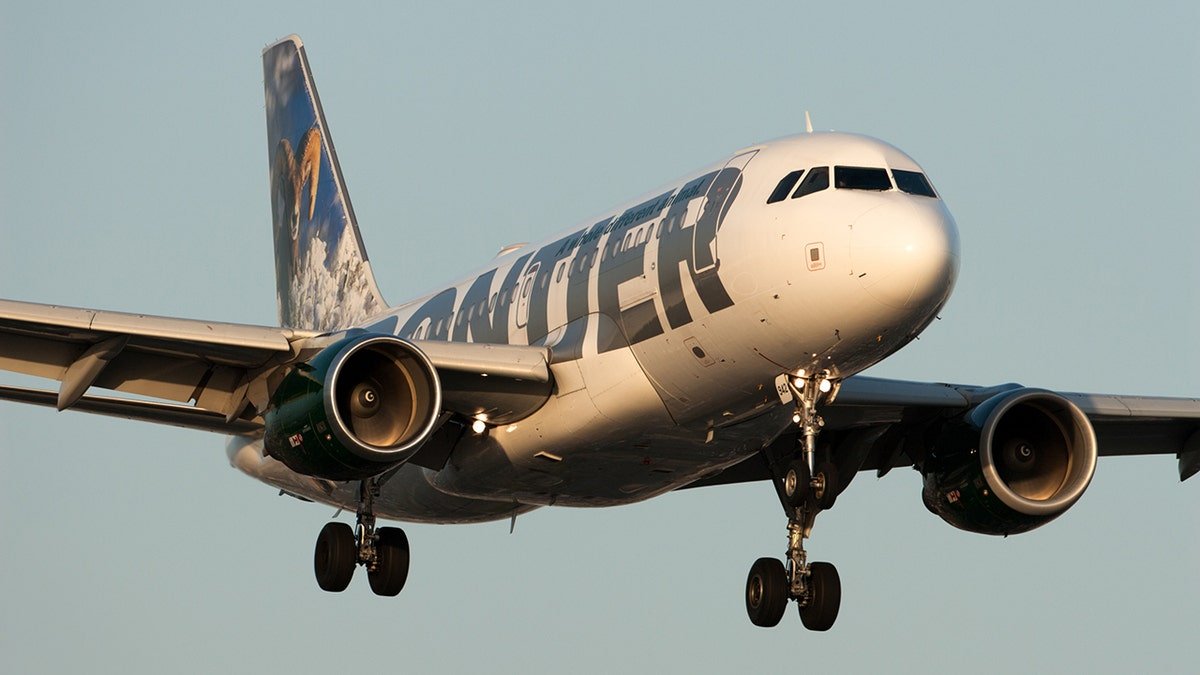 Frontier Airlines Airbus A319 aircraft approaching runway for landing at Los Angeles International Airport
