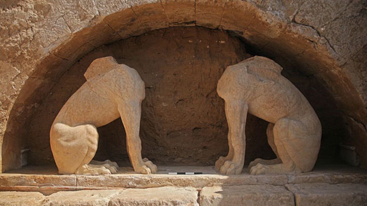 Destroyed carving of lions at site