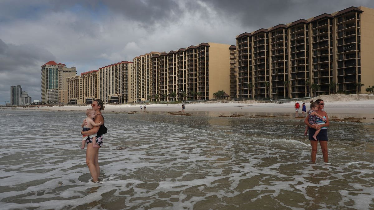 Families playing in the water at Orange Beach Alabama