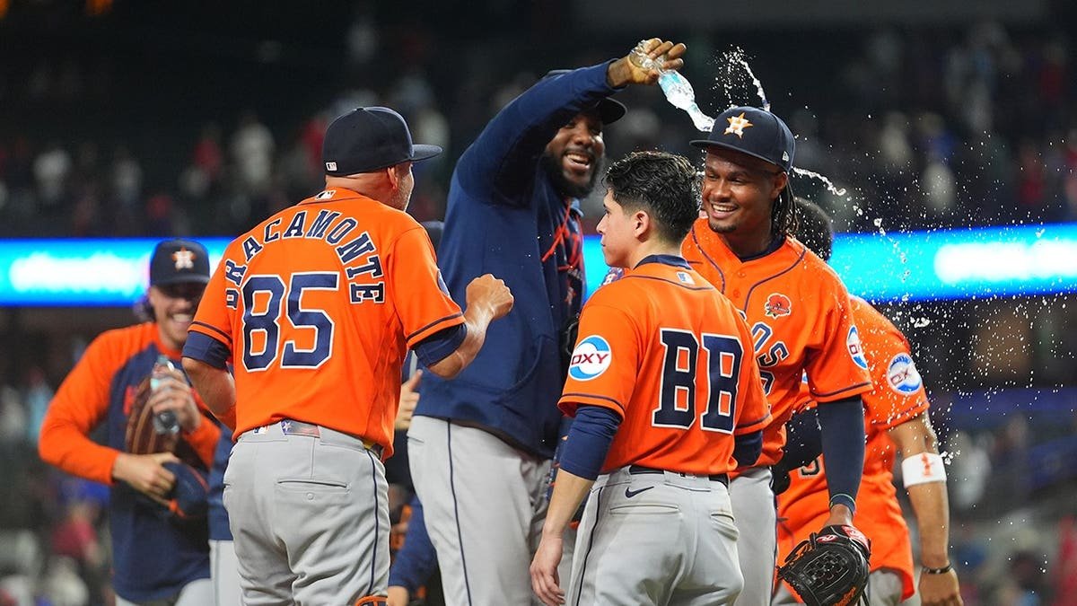 Alimber Santa being doused with water after pitching in major league debut
