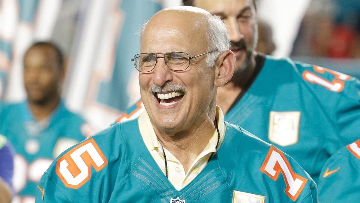 Former Miami Dolphins player Manny Fernandez smiling during halftime ceremony