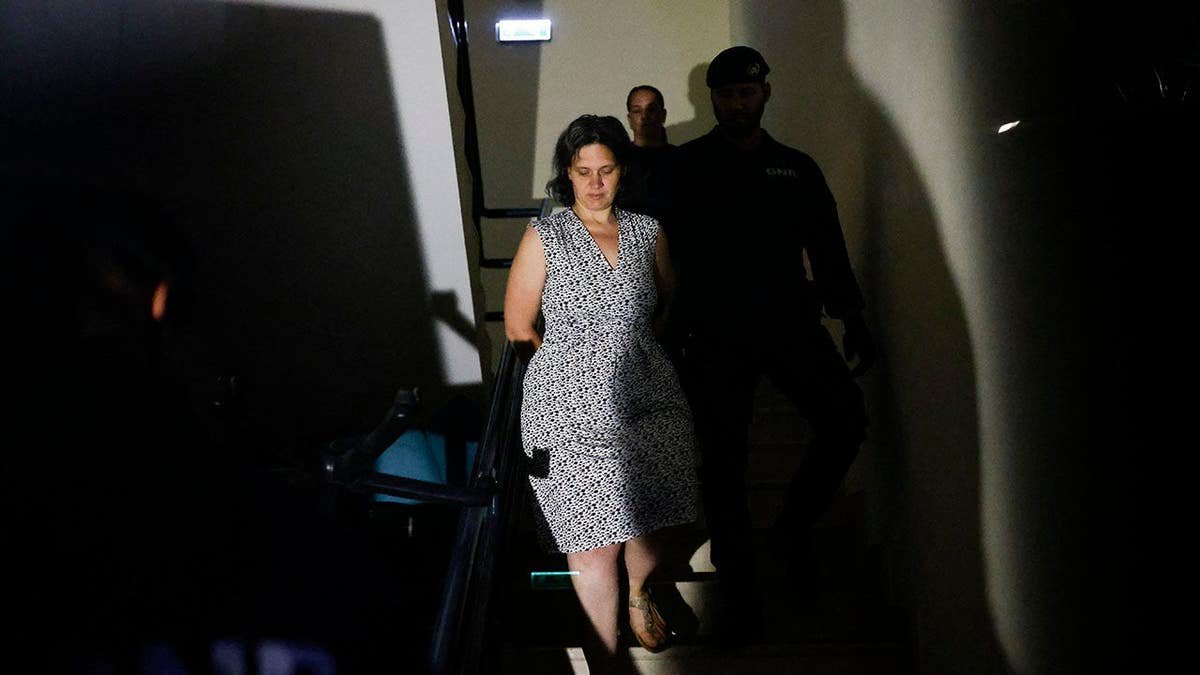 Marine Rousseau being arrested