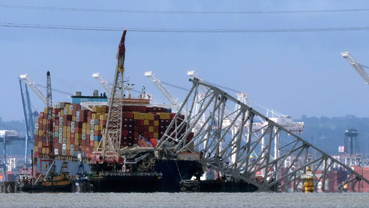 The collapsed Francis Scott Key Bridge resting on the container ship Dali in Baltimore