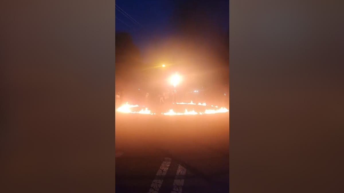 a ring of fire seen on neighborhood street at night