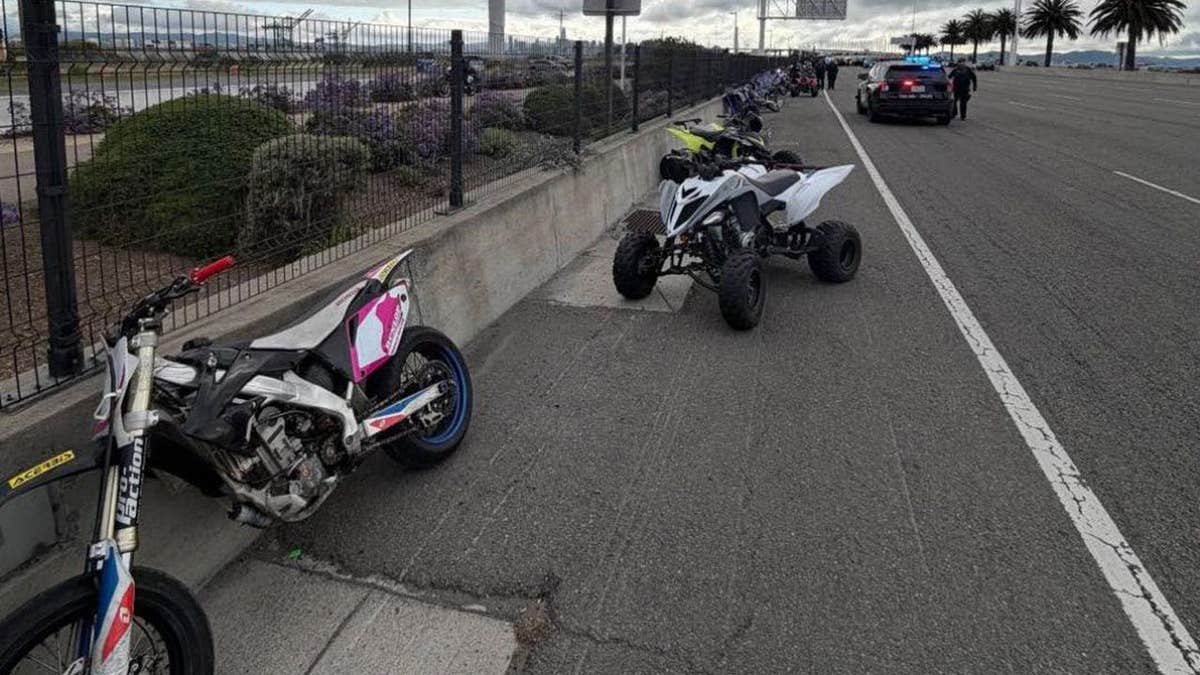 bike and ATV seen along side of bridge