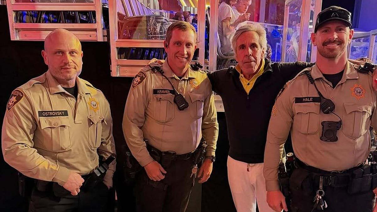 Palm Beach Pete poses with sheriff’s deputies in Palm Beach