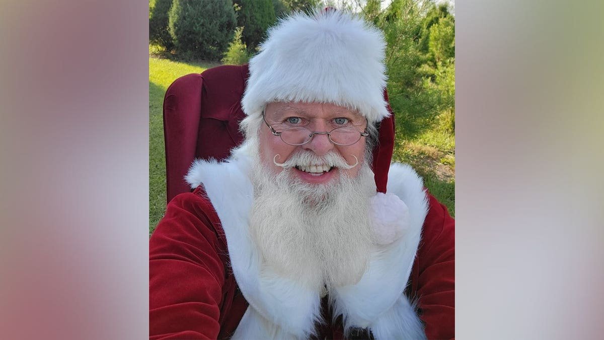 Suspect Thomas Allen Hicks poses in a Santa suit
