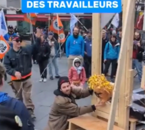Police probe mock beheading of Quebec labour minister effigy at Montreal rally