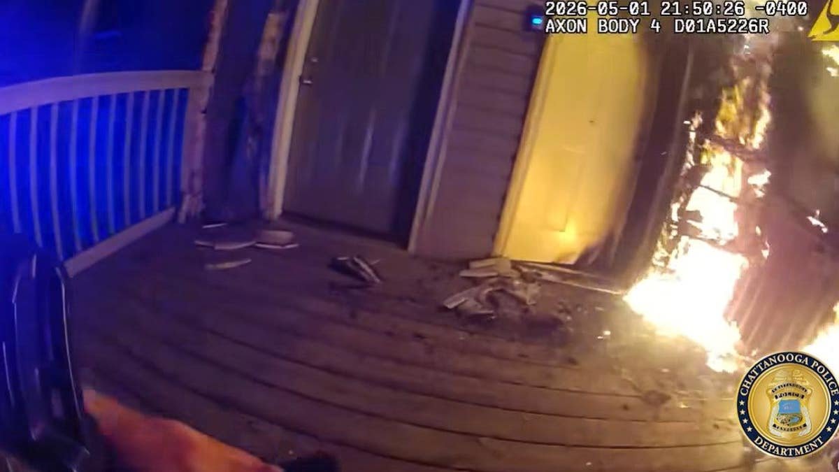 A house on fire on the front porch.