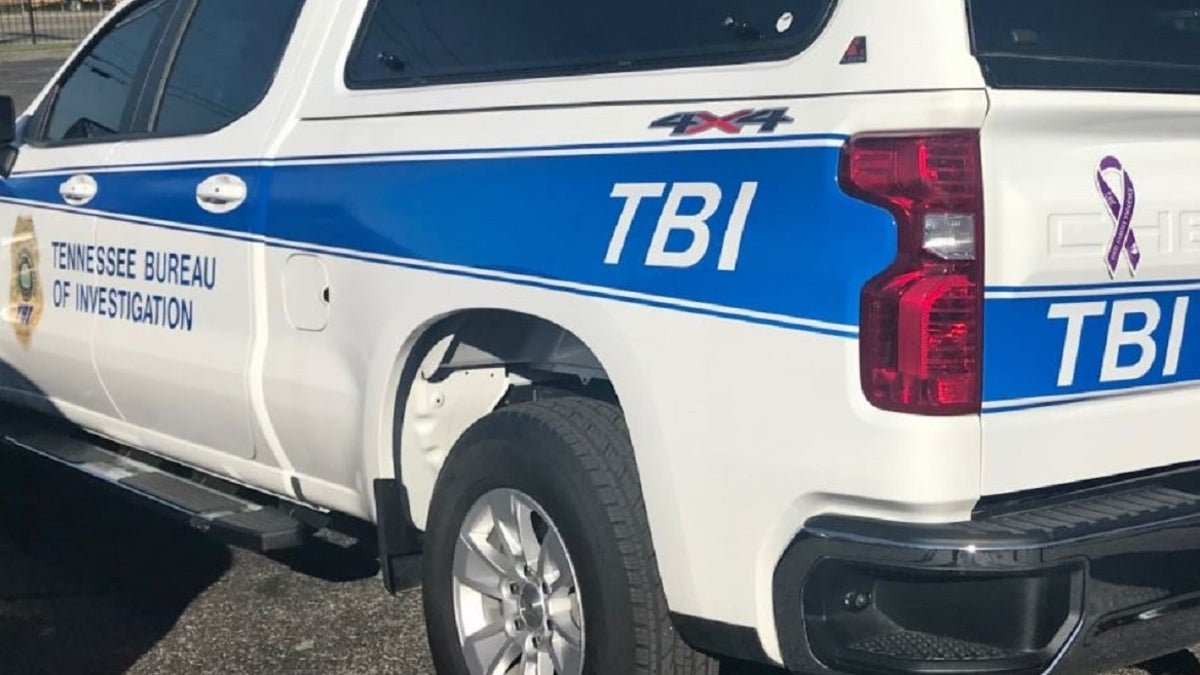 A Tennessee Bureau of Investigation car parked outside