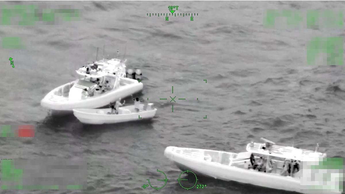 A pair of three boats are displayed in black and white