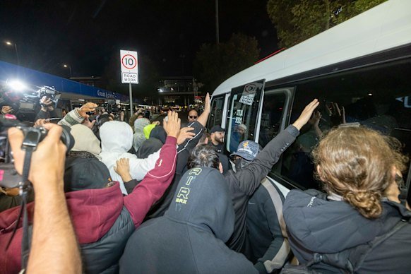 The large group of supporters and media at Melbourne Airport when a group of women and children arrived on May 7.