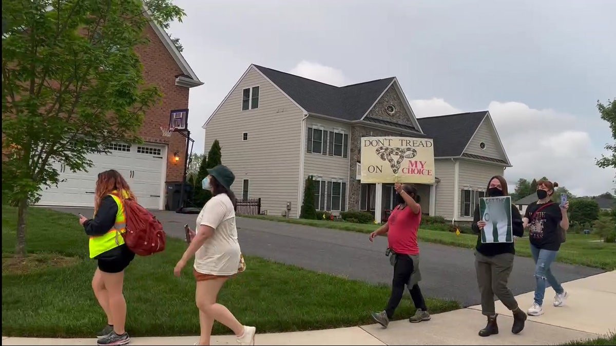 Protesters gathered near the home of Justice Barrett