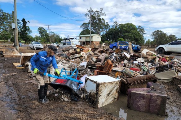 A Disaster Relief Australia volunteer cleaning up after the Lismore flood. 
