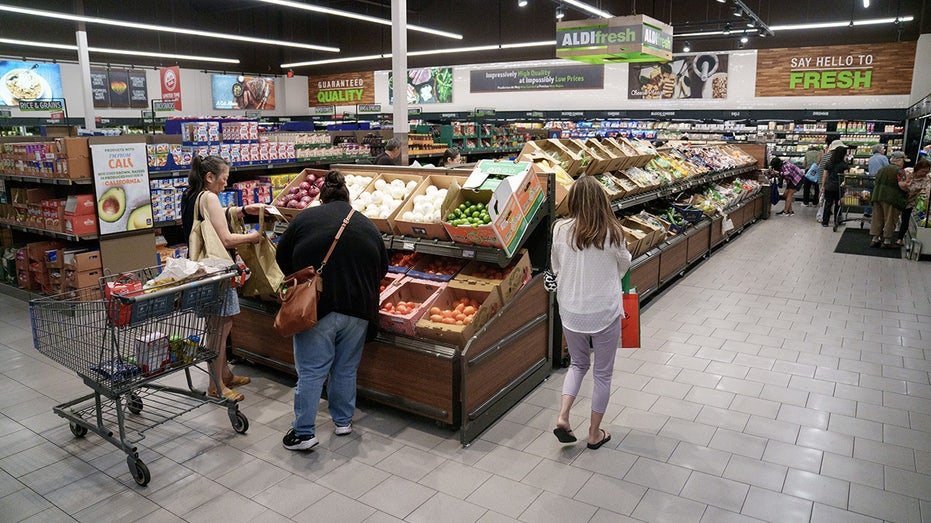 People shop at an Aldi grocery store.