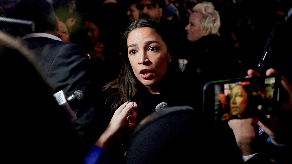 Rep. Alexandria Ocasio-Cortez speaking to reporters at an election night rally in Brooklyn New York