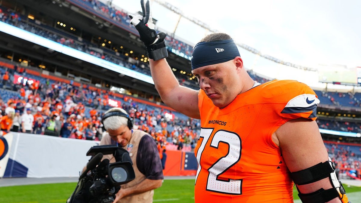 Denver Broncos offensive tackle Garett Bolles walking on field after win