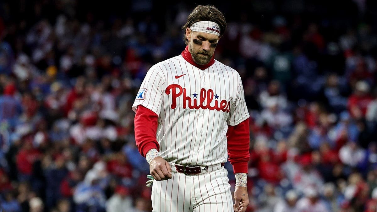 Bryce Harper standing on the field at Citizens Bank Park.
