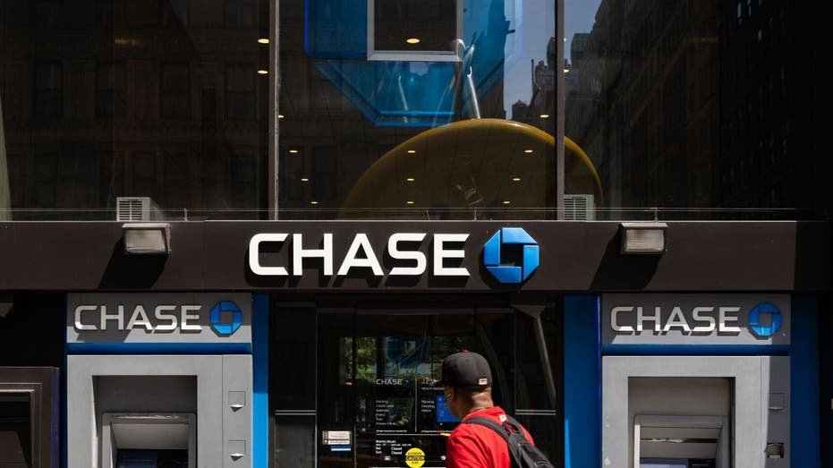 A person walking by Chase ATM