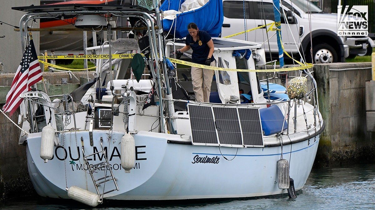U.S. Coast Guard investigators searching the boat Soulmate docked at Fort Pierce station