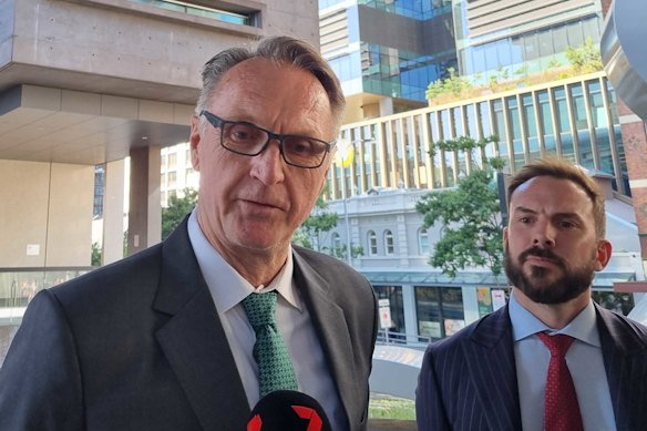 Olympian Neil Brooks leaves court after he was committed to stand trial in 2023.