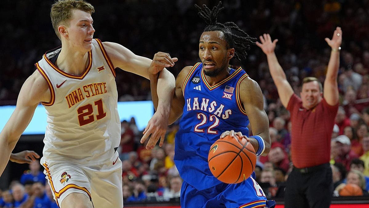 Kansas Jayhawks guard Darryn Peterson drives with the ball past Iowa State Cyclones forward Dominykas Pleta at Hilton Coliseum