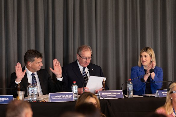 Opposition Leader Angus Taylor (left) at the Victorian Liberal state council on Saturday alongside new state president Brian Loughnane and the state opposition leader, Jess Wilson.