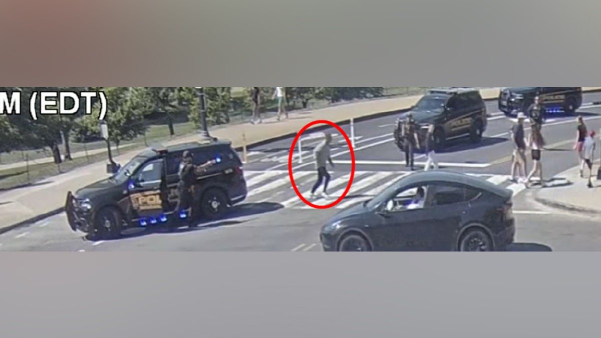 Police officers standing near a crime scene in Washington D.C.