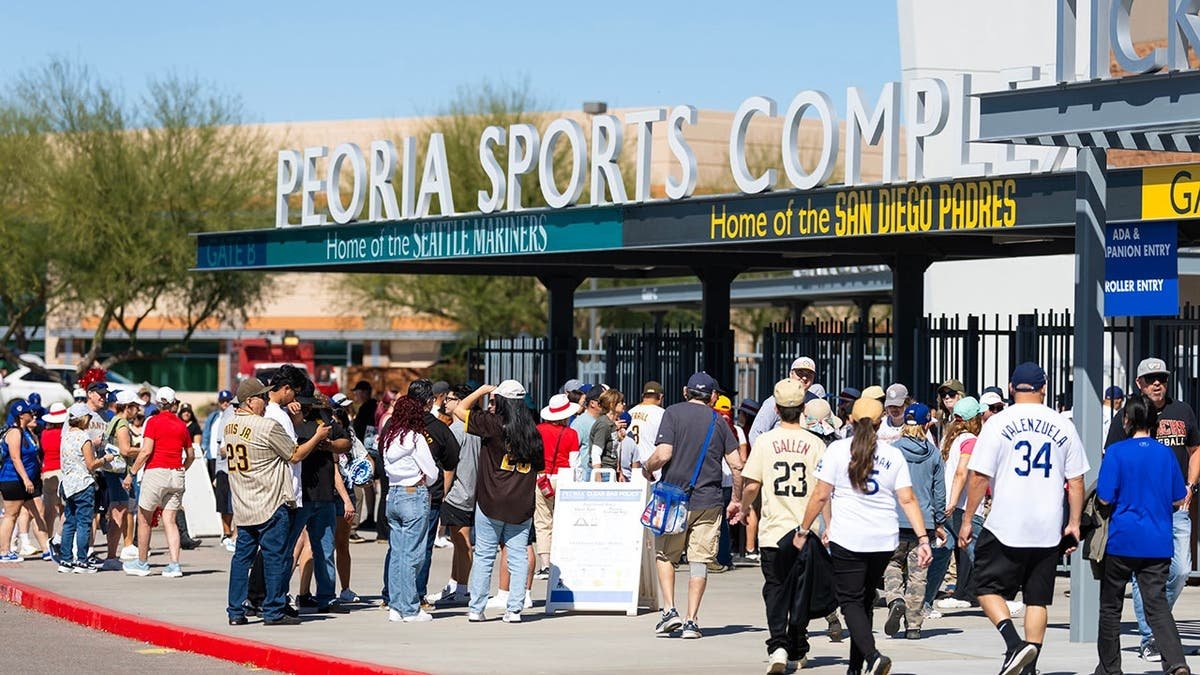Fans arriving at entrance gates of Peoria Sports Complex for Dodgers Padres spring training game