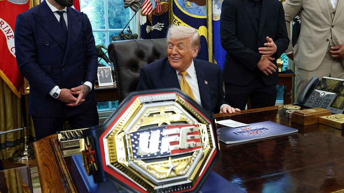 U.S. President Donald Trump standing with UFC fighters Ilia Topuria, Justin Gaethje, and Ciryl Gane in the Oval Office