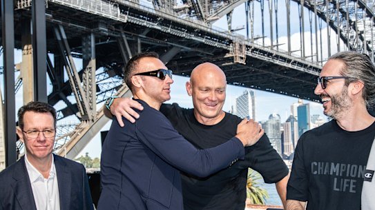 Olympic swimmer Michael Klim hugging Ian Thorpe at the launch of his foundation on Wednesday at North Sydney Olympic Pool, which has yet to open to the public. 