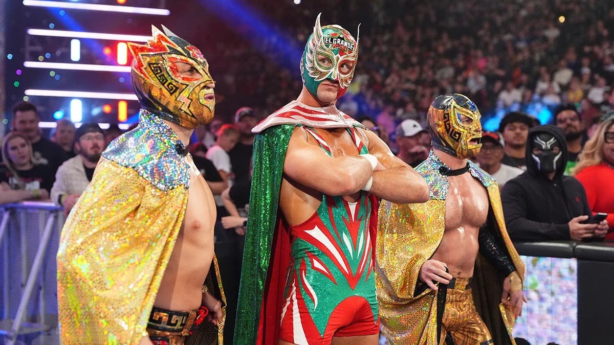 El Grande Americano entering arena accompanied by Rayo Americano and Bravo Americano during Monday Night RAW