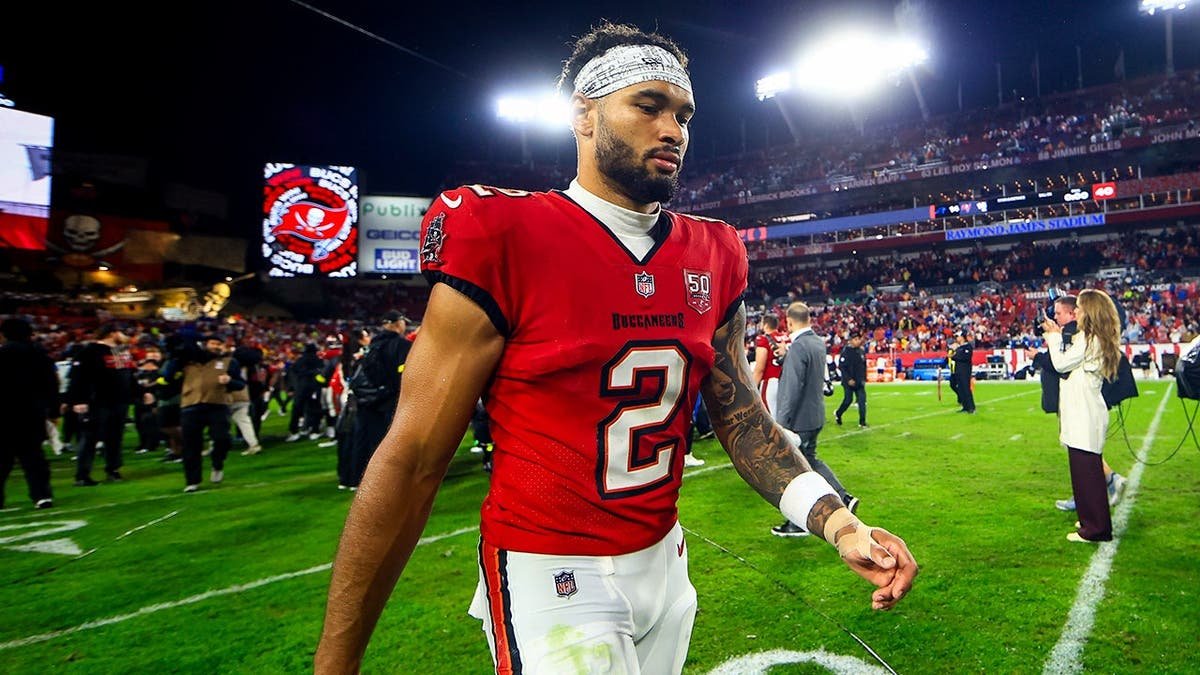 Emeka Egbuka walking off the field at Raymond James Stadium in Tampa