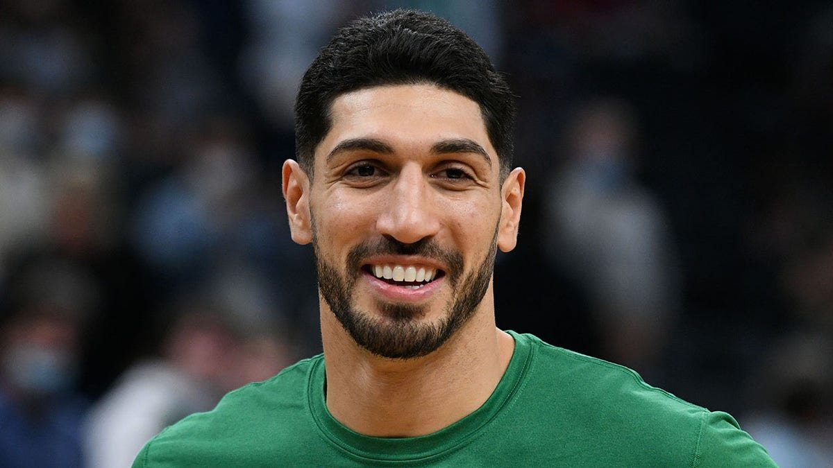 Boston Celtics center Enes Kanter standing on the basketball court at TD Garden.