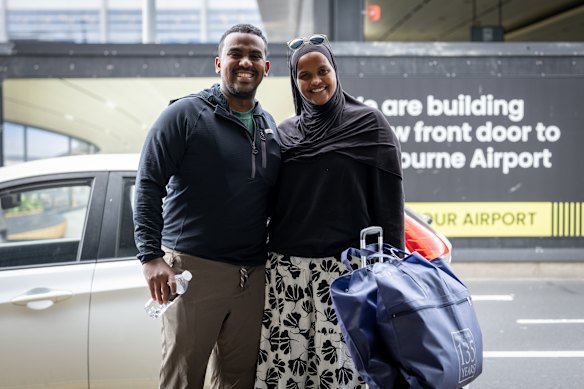 Badar Dore (left) and Fatumo Elmi at Melbourne Airport in front of the new pedestrian bridge.