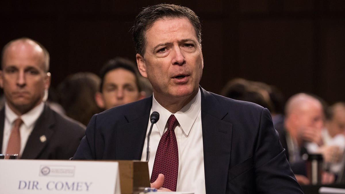 Former FBI director James Comey speaking before lawmakers