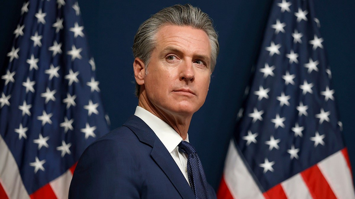 California Gov. Gavin Newsom looking on during a bill signing event in Sacramento